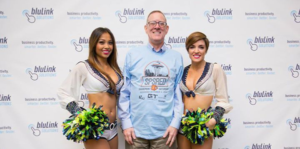 Standing with a pair of Seahawk Seagals professional cheerleaders during SharePoint Saturday